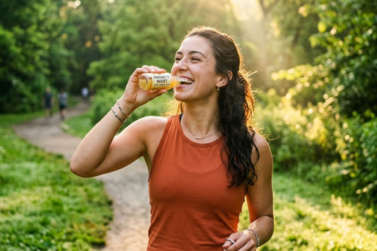 Energetic person outdoors drinking a wellness shot to boost immunity and energy